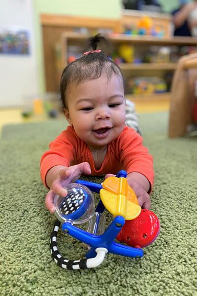 Learning Paths Academy, Baby Steps, Little girl playing with toy