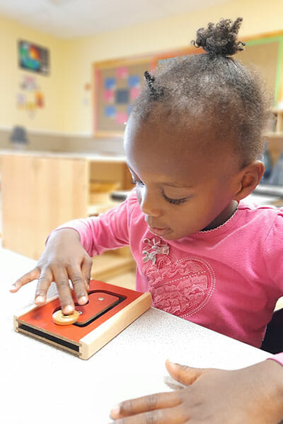 Learning Paths Academy, Toddler Explorer Program, Little girl playing a game